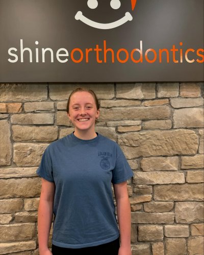 Girl smiling showing her teeth 
