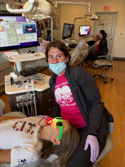 orthodontist working with patient